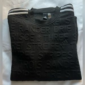 Adidas crewneck sweatshirt with embossed allover word pattern. Size Medium